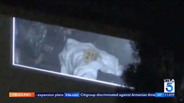 Members of the Los Angeles Police Department are seen marking evidence inside Haskell's home on Wednesday.