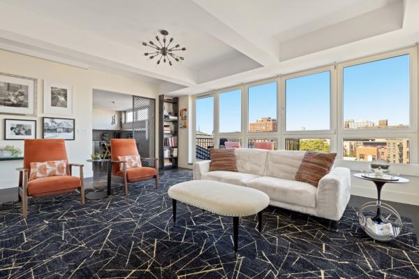 The living space with floor-to-ceiling windows. 