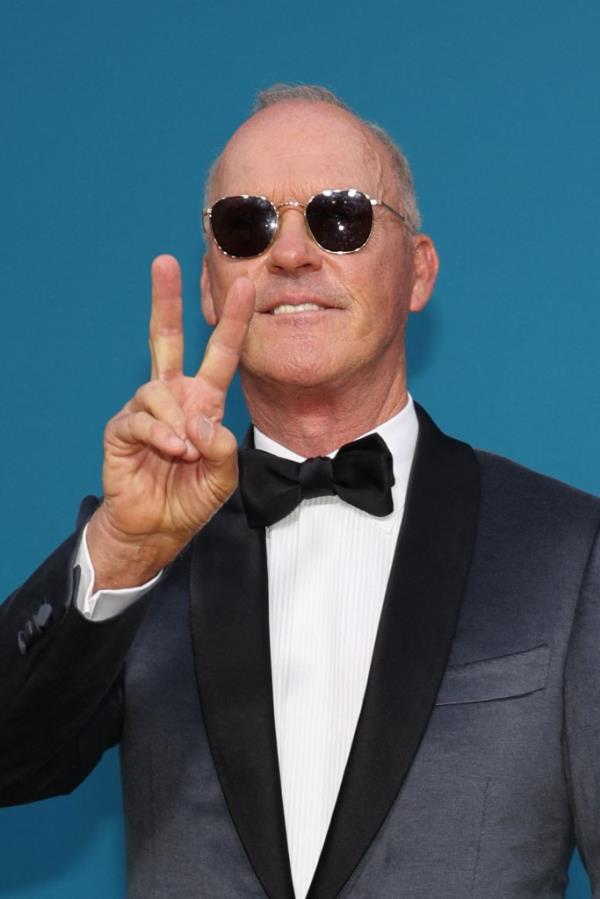 Michael  Keaton flashing a peace sign