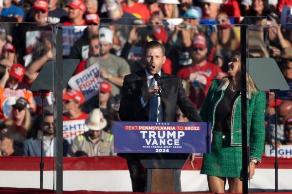 Eric and Lara Trump speak before president Do<em></em>nald Trump takes the stage at a campaign rally in Butler, Pa., on October 5, 2024.