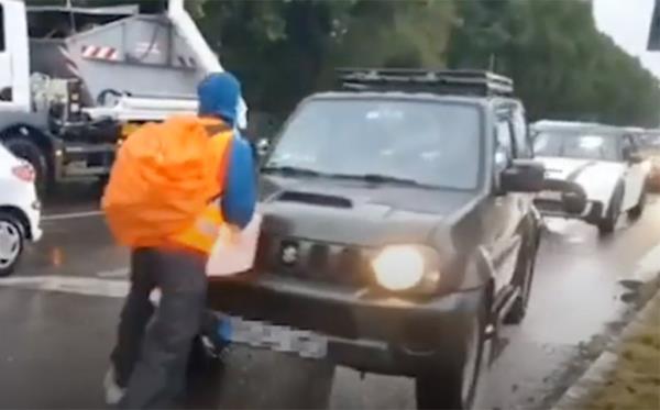 According to the video, the protesters were blocking a street in a staged protest.