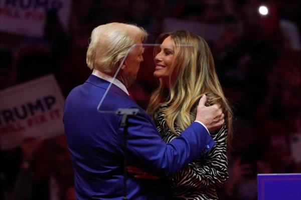 Trump held Melania as he walked o<em></em>nto the stage at Madison Square Garden.