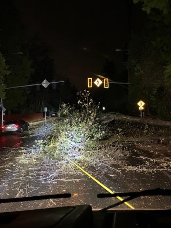 Debris lies in the middle of an intersection as the power was knocked out for the stop light. 