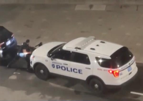 The Worcester cop tried to muscle the SUV into stopping, but it rolled right through him. 