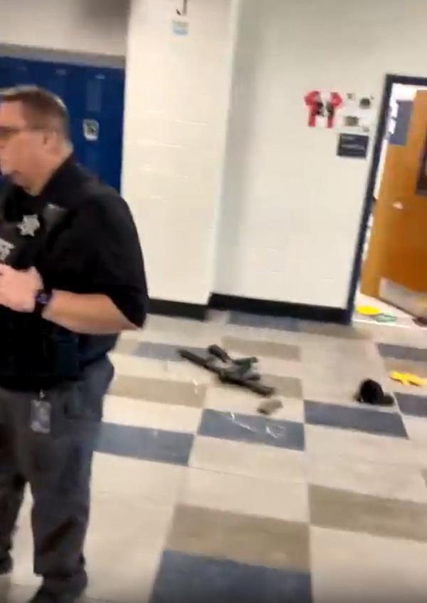 Gun seen on the ground at the high school