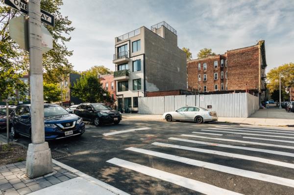 Signs of new development in Ocean Hill, wher<em></em>e newly-designed modern residential buildings are rising on once-abando<em></em>ned lots.