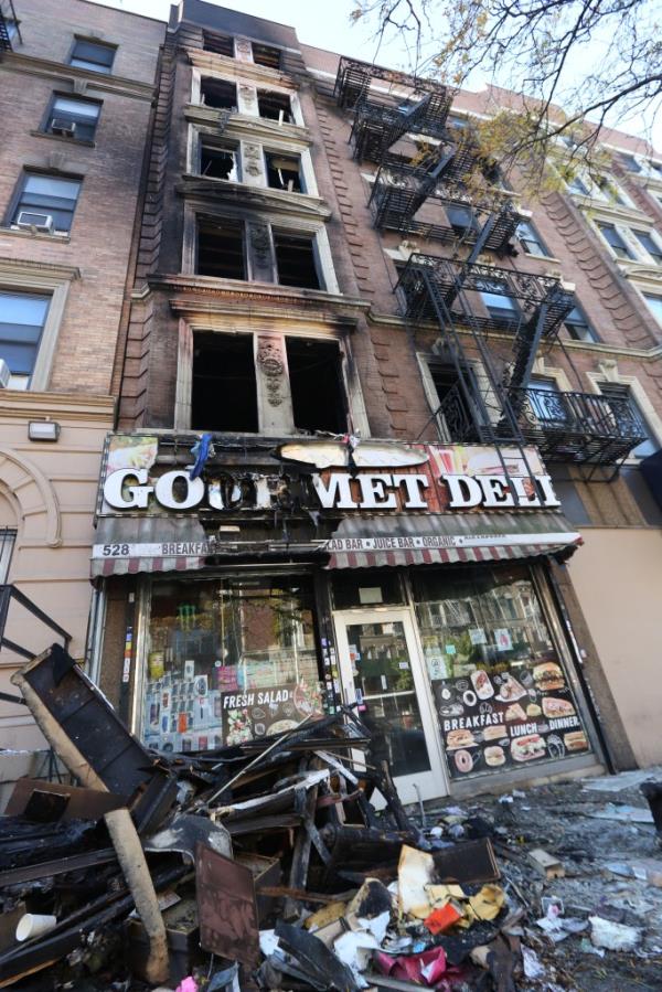 Damage seen at one of the stores on the ground floor of the building.