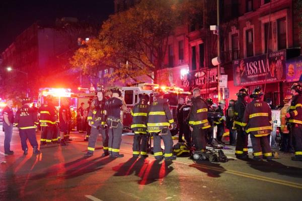 Firefighters doused the six-story apartment building that went up in flames Friday. 