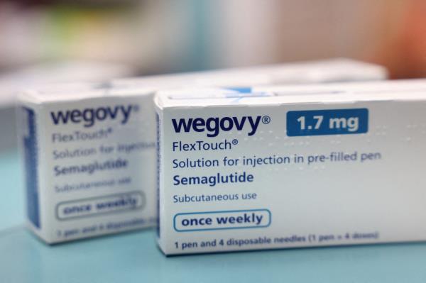 Boxes of the weight loss drug Wegovy by Novo Nordisk on a pharmacy shelf in London, Britain.