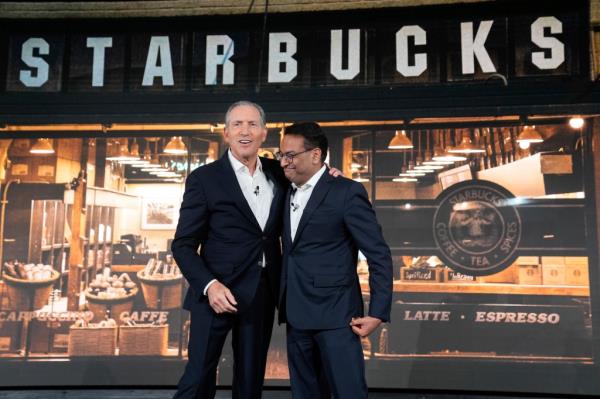 Thn-Interim Starbucks CEO Howard Schultz with then-incoming CEO Laxman Narasimhan on Sept. 13, 2022. Narasimhan left his position on Aug. 13, 2024.