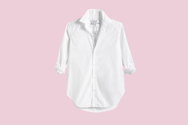Eva Lo<em></em>ngoria posing in a white shirt against a pink background