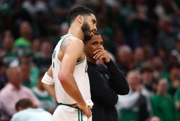 Jayson Tatum #0 talks with Boston Celtics head coach Joe Mazzulla during the fourth quarter.