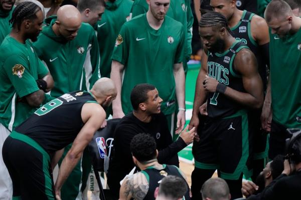 Joe Mazzulla, center, talks with his players during the first half of Game 2 of the NBA Finals.