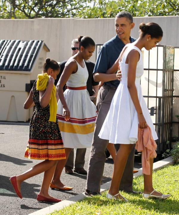 President Barack Obama and his family walks into a Christman morning church service at Marine Corps ba<em></em>se Kaneohe Bay in Hawaii on Dec. 25, 2011.