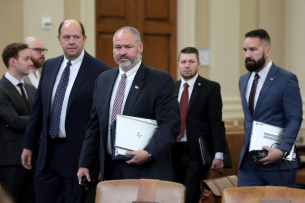 Internal Revenue Service Supervisory Special Agent Gary Shapley (2nd L) and IRS Criminal Investigator Joseph Ziegler (R), who both worked on the federal investigation into Hunter Biden, arrive for a hearing before the House Ways and Means Committee in the Lo<em></em>ngworth House Office Building on December 5, 2023 in Washington, DC.