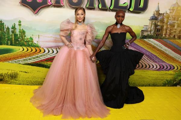 Ariana Grande and Cynthia Erivo posing at the Australian premiere of 'Wicked', dressed in Vivienne Westwood and Louis Vu respectively
