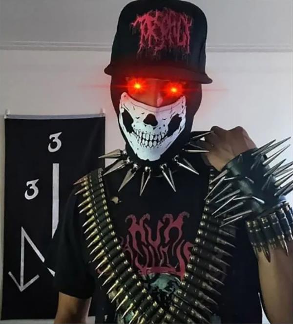 In another social media photo, Almeida posed in front of an O9A flag.