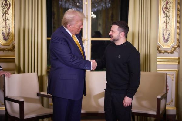 Ukrainian President Volodymyr Zelenskyy, right, shakes hands with U.S president-elect Do<em></em>nald Trump, left, before a bilateral meeting at the Elysee Palace, December 7, 2024 in Paris, France. 