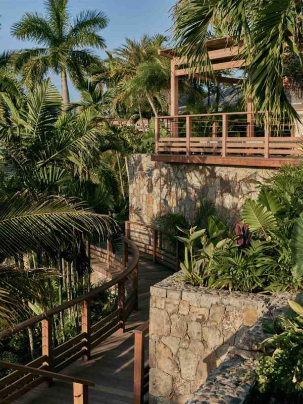 Located on 2 acres in the Colombier district's Les étoiles gated community, the estate features nine bungalows co<em></em>nnected by teak walkways and locally sourced blue rock steps.