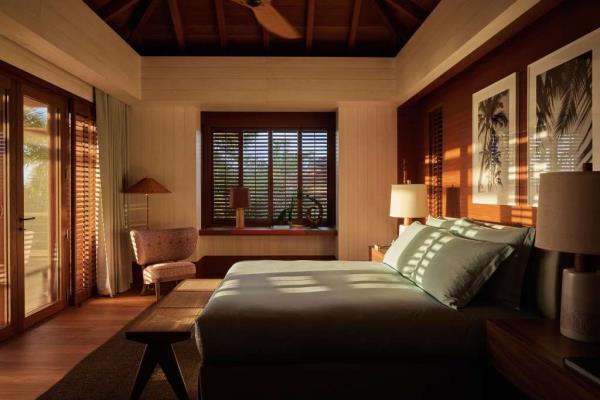 Designed by Remi Tessier, the property blends natural materials like Doussié wood and brushed spruce with over 70 tropical plant varieties.