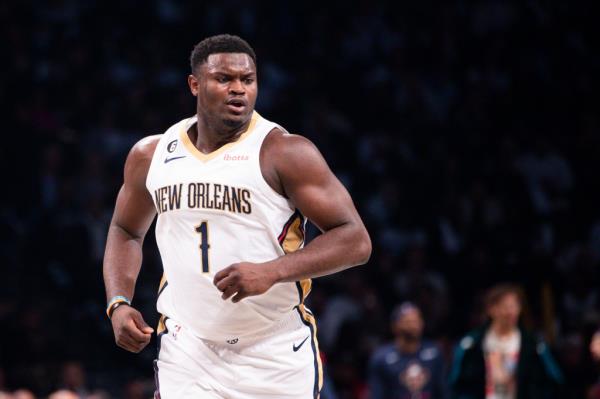 Pelicans forward Zion Williamson (1) runs up court in the second half against the Brooklyn Nets