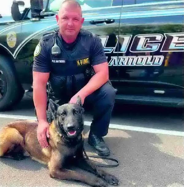 Arnold police dog Vader, along with Police Officer Timothy Mayberry, in a 2023 photo from Arnold.
