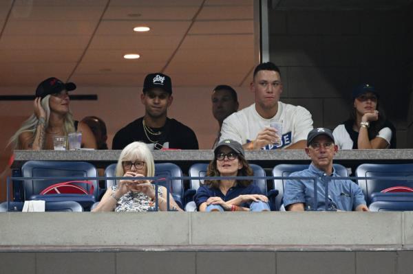 Yankees players Keynan Middleton, Aaron Judge and his wife Samantha.