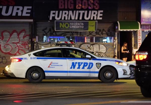 Police driving past a Queens brothel. 