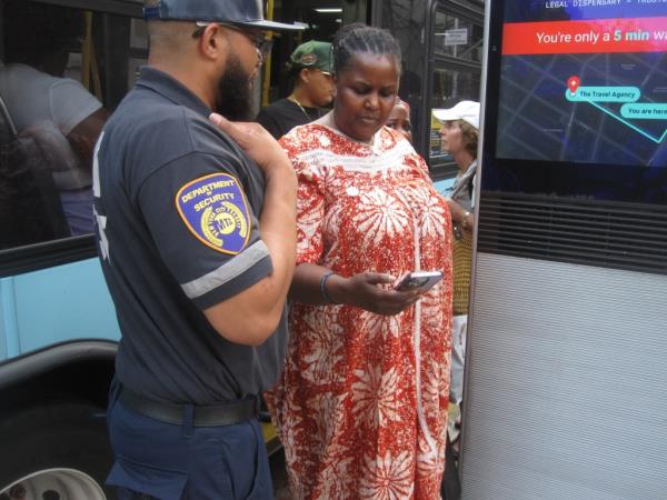 An MTA Agent checking bus rider's fare receipt at multiple stop locations.