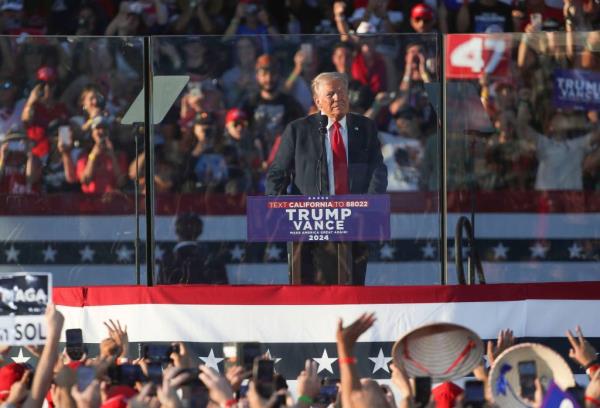 Do<em></em>nald Trump speaking at a podium during his campaign rally in Coachella, California with a crowd in the background, dated Oct. 12, 2024.