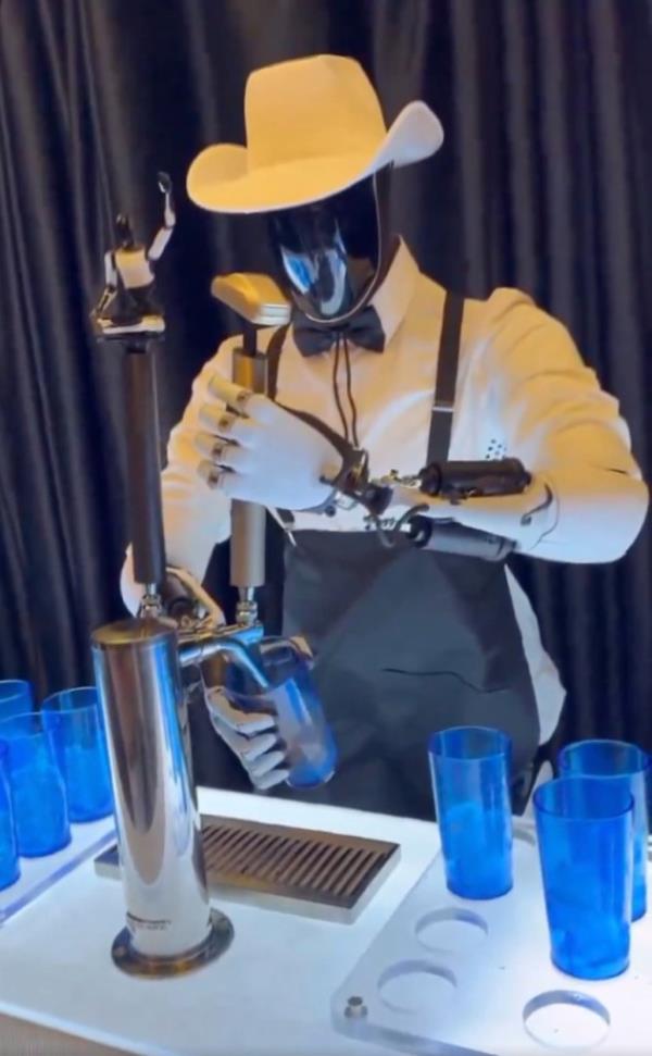 Optimus robot serving a drink at the event on Oct. 10, 2024.
