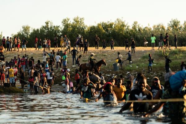 Migrants crossing the Rio Grande