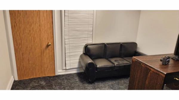 A close-up of the set, showing the couch with stains on it.