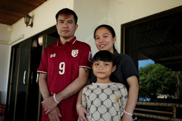 Munkan and her partner pictured with their daughter after they were released last week.