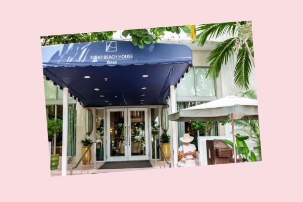 A woman sitting in front of Soho Beach House