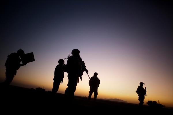Soldiers patrol desert near border with Pakistan.