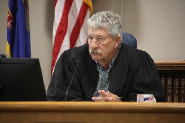 South Central District Judge Bruce Romanick listens to arguments by attorneys during a hearing challenging North Dakota's abortion laws, July 23, 2024, in Bismarck, N.D.