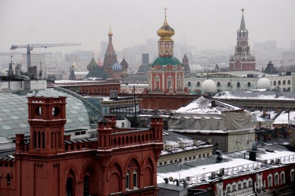 A view of the roofs of Moscow, with the Kremlin's o<em></em>nion dome at the center.