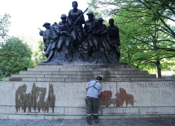 Clean up crews arrived early Tuesday to scrub the World War I memorial in Central Park that was vandalized by anti-Israeli protesters overnight. 