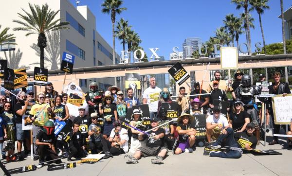 Actors, writers and cosplayers join striking members of SAG-AFTRA and WGA on the picket line in front of FOX Studios on September 26, 2023 in Los Angeles, California. 