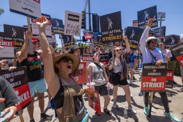 Members of the Hollywood actors SAG-AFTRA unio<em></em>n walk a picket line with screenwriters outside of Paramount Studios on Day 2 of the actors' strike on July 14, 2023 in Los Angeles, California.