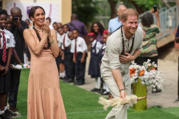Prince Harry and Meghan, Duke and Duchess of Sussex, participating in activities at Lightway Academy in Abuja, Nigeria for Invictus Games anniversary.
