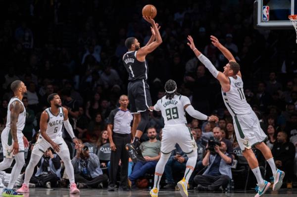 Nets forward Mikal Bridges (1) shoots over Milwaukee Bucks forward Jae Crowder (99) and center Brook Lopez (11)