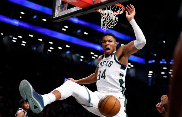 Bucks forward Giannis Antetokounmpo (34) reacts after a dunk against the Brooklyn Nets