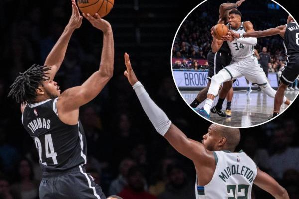 Bucks forward Giannis Antetokounmpo (34) drives past Brooklyn Nets guard Lo<em></em>nnie Walker IV (8)