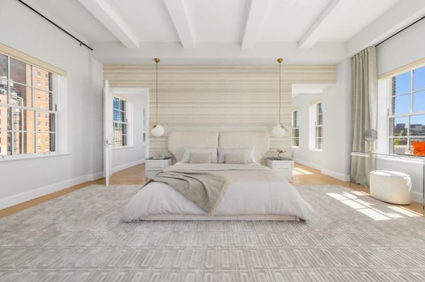 The primary bedroom in the posh penthouse
