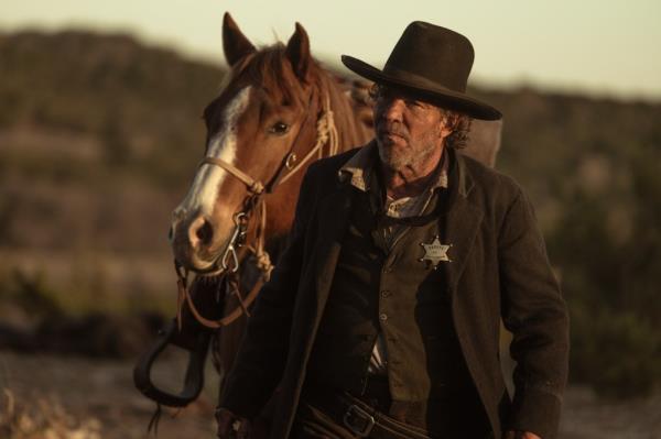 Dennis Quaid with a horse. 