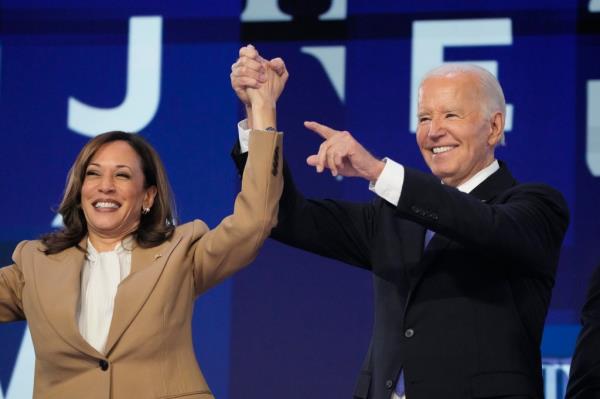President Joe Biden speaking at the podium with Vice President Kamala Harris at the Democratic Natio<em></em>nal Co<em></em>nvention in Chicago
