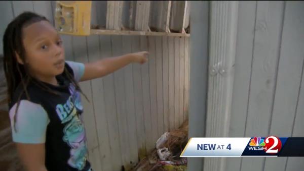 Angelo Owens points out wher<em></em>e he first saw the snake in his grandmother’s backyard.
