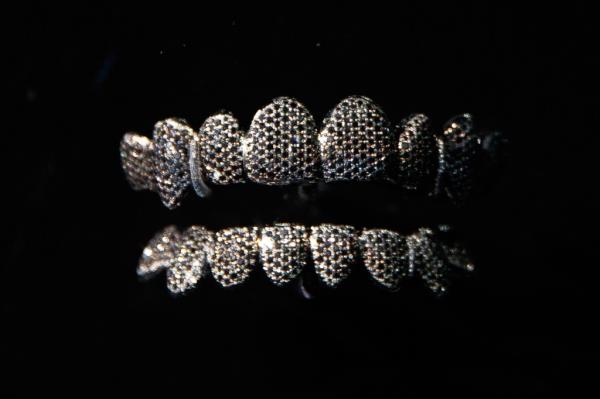 Display case showcasing custom-made hip-hop jewelry worn by music's biggest stars at the American Museum of Natural History exhibition